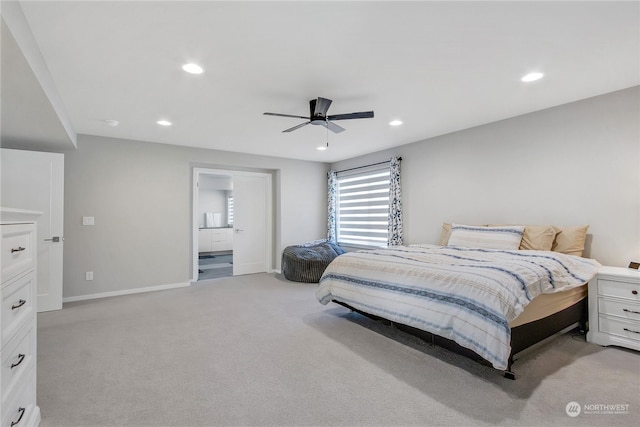 carpeted bedroom featuring connected bathroom and ceiling fan