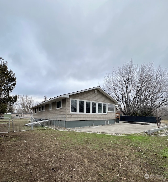 view of side of home featuring a patio