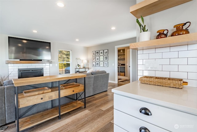 kitchen with white cabinetry and light hardwood / wood-style floors