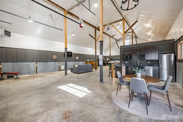 interior space featuring sink and high vaulted ceiling