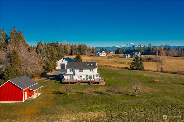 birds eye view of property featuring a mountain view and a rural view