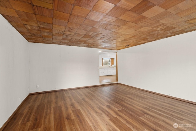 basement with hardwood / wood-style floors