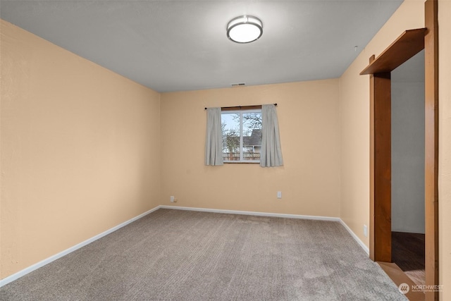 empty room with light colored carpet