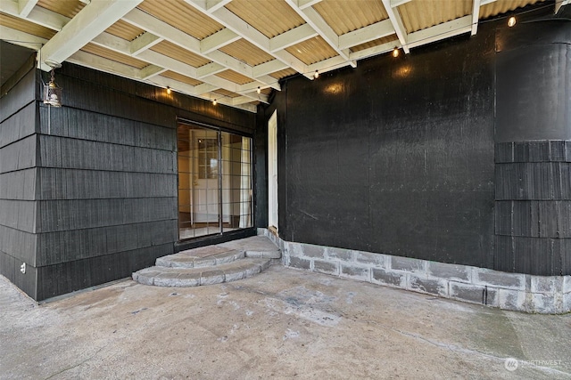 doorway to property featuring a patio area