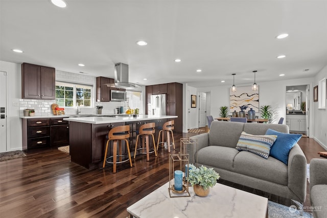 living room with sink and dark wood-type flooring