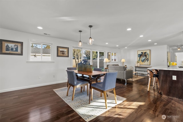 dining area featuring dark hardwood / wood-style floors