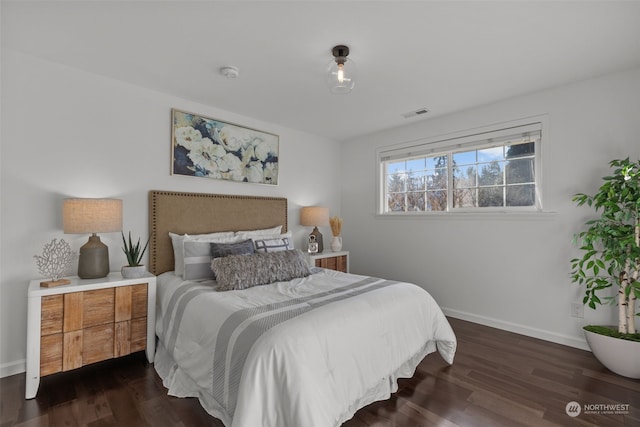 bedroom featuring dark hardwood / wood-style floors