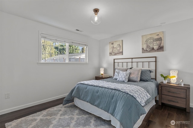 bedroom featuring dark wood-type flooring