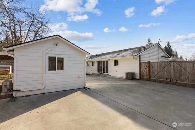 back of property with a patio and central AC unit