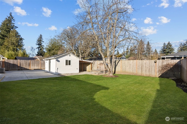 view of yard featuring a patio area, central AC, and a shed