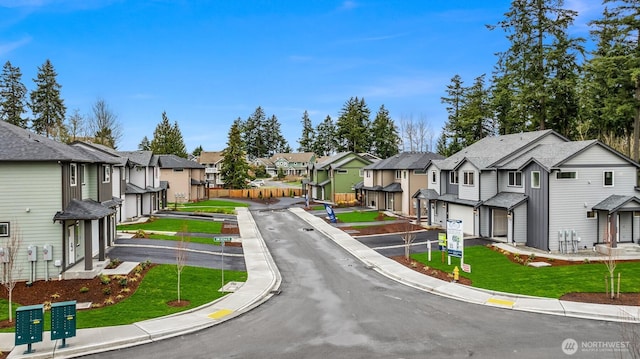 view of street with sidewalks, curbs, and a residential view