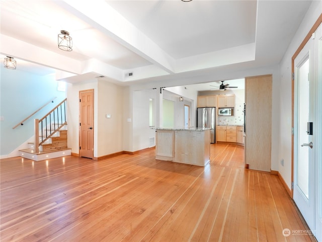 unfurnished living room featuring light hardwood / wood-style flooring