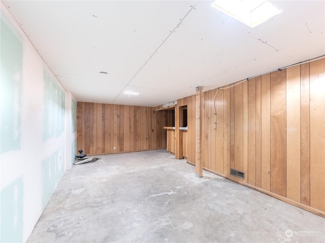 basement with wooden walls