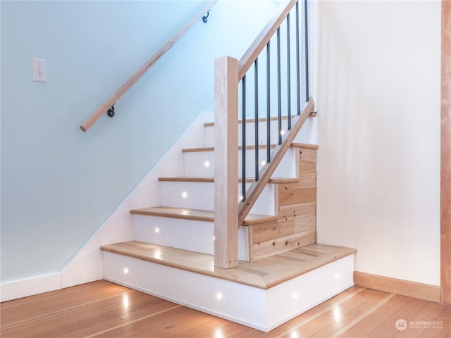 staircase featuring hardwood / wood-style flooring