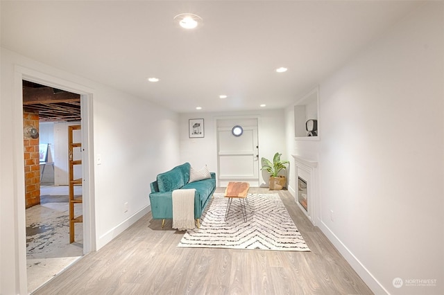 sitting room featuring light hardwood / wood-style floors