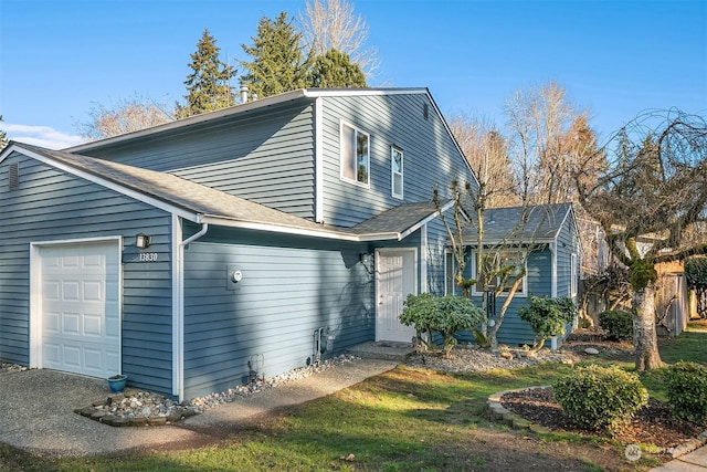 view of property exterior with a garage