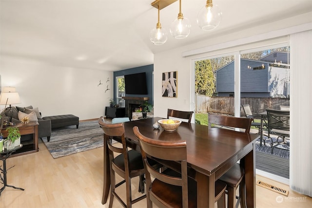 dining space featuring a healthy amount of sunlight and light wood-type flooring