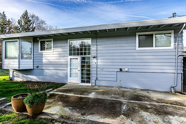 rear view of house featuring a patio