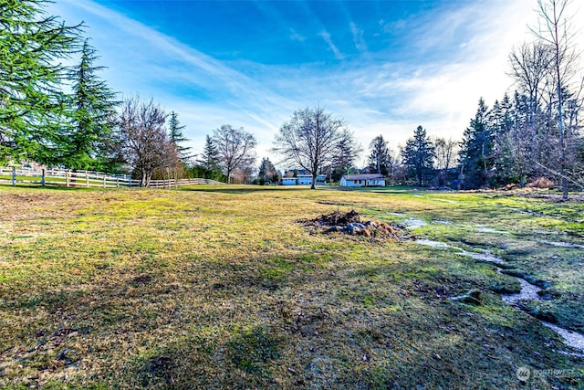 view of yard with a rural view