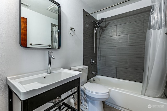 full bathroom featuring sink, toilet, and shower / bathtub combination with curtain