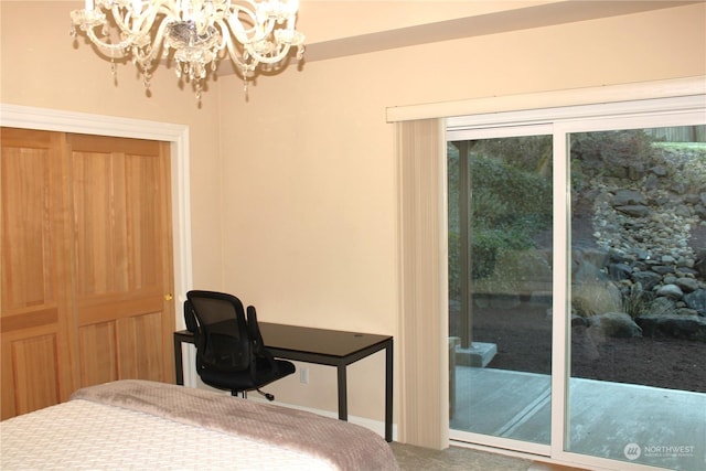 bedroom featuring an inviting chandelier