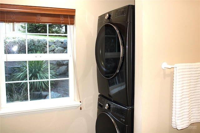 laundry room with stacked washer and dryer