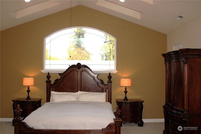 carpeted bedroom featuring lofted ceiling