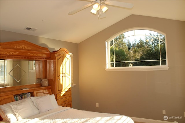 bedroom featuring lofted ceiling and ceiling fan