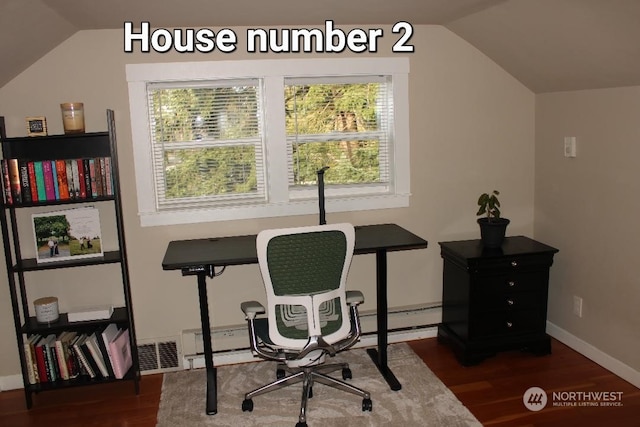 office space featuring vaulted ceiling and dark hardwood / wood-style floors