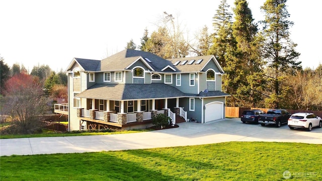 view of front of house with a garage, a front lawn, a porch, and concrete driveway