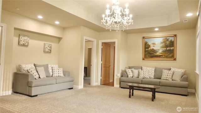 carpeted living room featuring baseboards, a tray ceiling, and recessed lighting