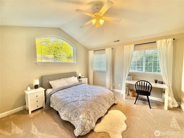 bedroom with carpet, visible vents, a ceiling fan, vaulted ceiling, and baseboards