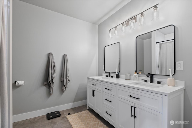 bathroom with tile patterned flooring and vanity