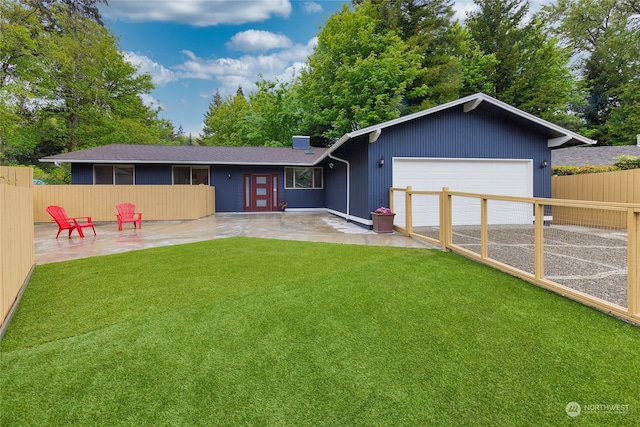 view of front facade featuring a garage, a patio area, and a front lawn