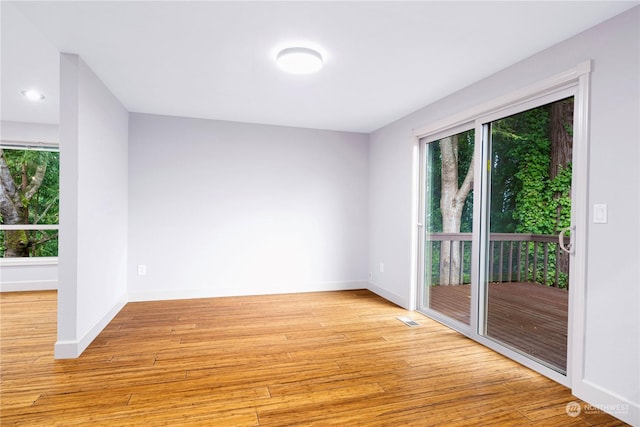 unfurnished room with light hardwood / wood-style floors