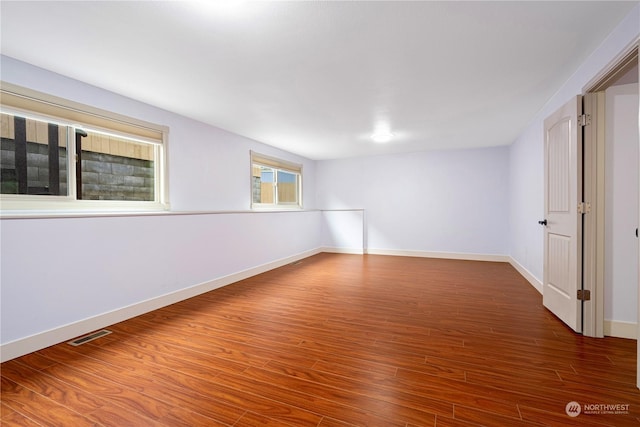 unfurnished room featuring dark hardwood / wood-style floors