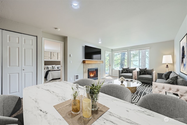 living room with a tile fireplace