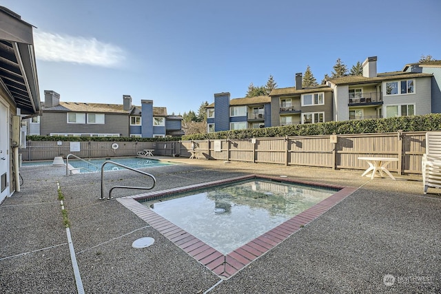 view of swimming pool featuring a patio area