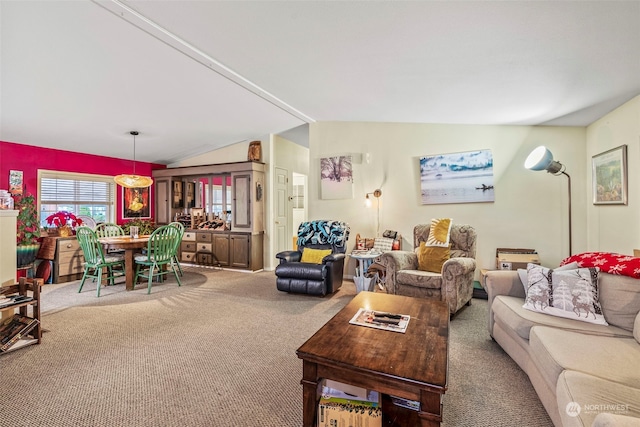 living room featuring lofted ceiling and carpet flooring