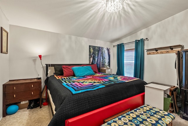 bedroom with lofted ceiling and carpet