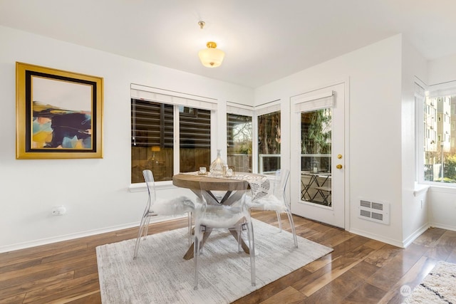 dining room with dark wood-type flooring