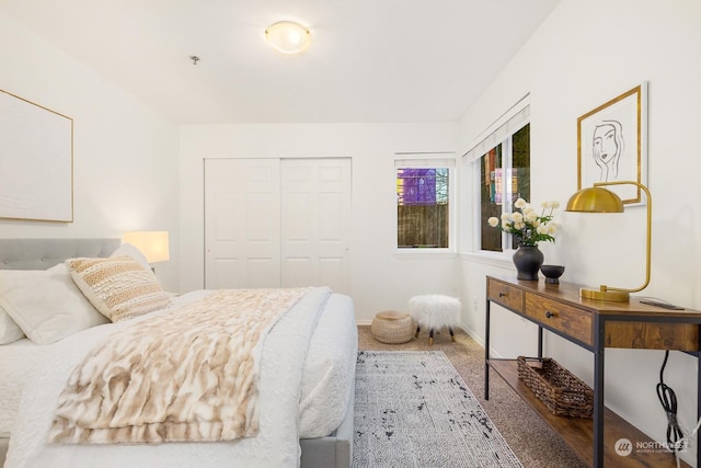 carpeted bedroom featuring a closet