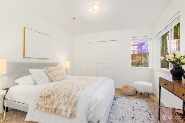 carpeted bedroom with a closet