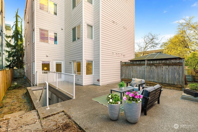 view of patio featuring an outdoor living space and a gazebo