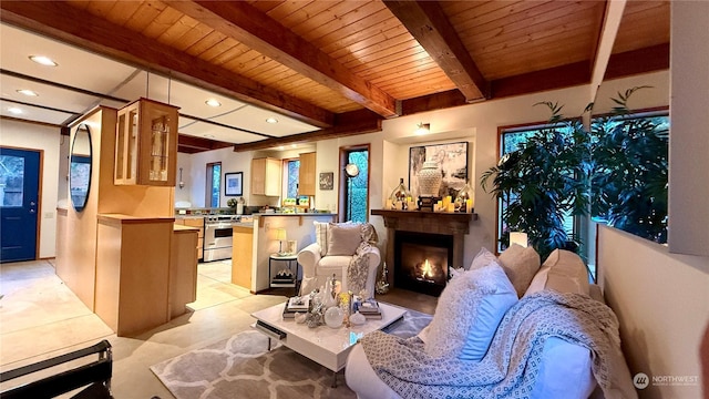 living room with wood ceiling and beamed ceiling