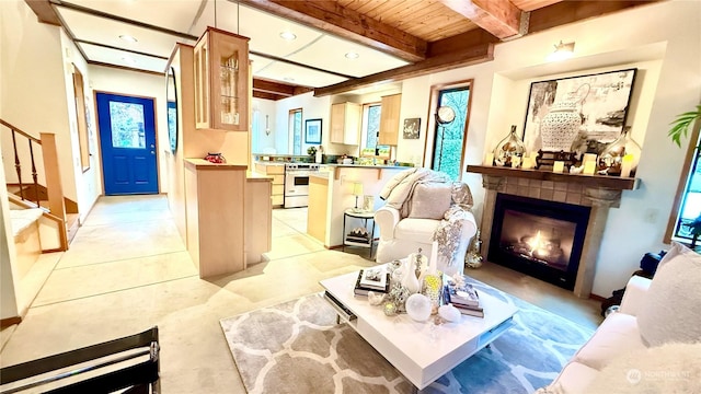 living room featuring wood ceiling and beam ceiling