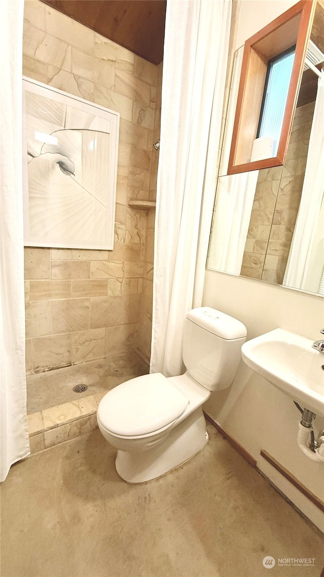 bathroom featuring sink, toilet, and walk in shower