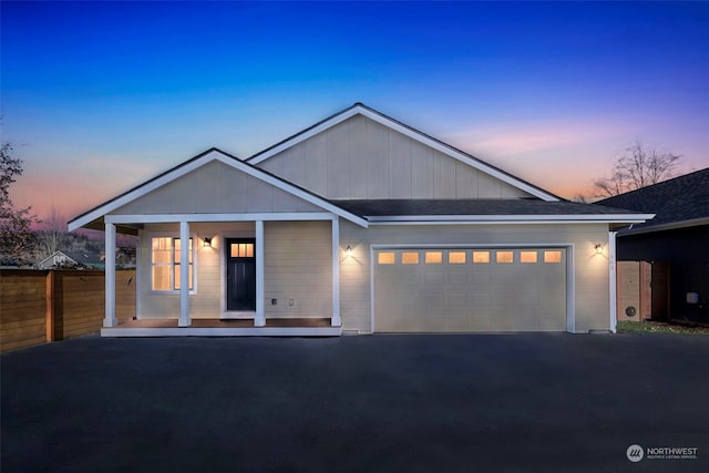 view of front of house featuring a garage and a porch