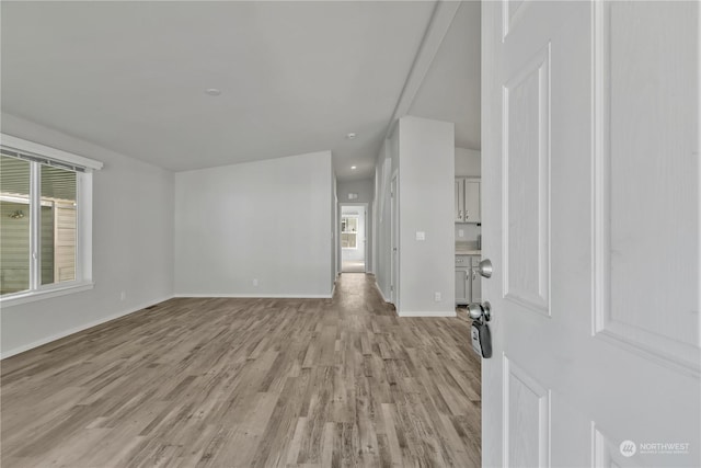 unfurnished living room with light hardwood / wood-style floors