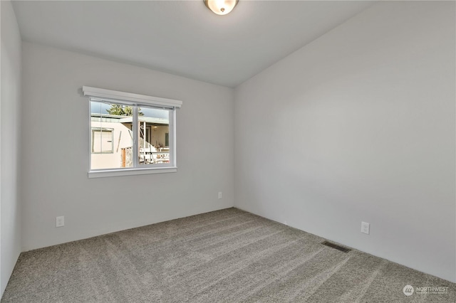 unfurnished room featuring carpet floors